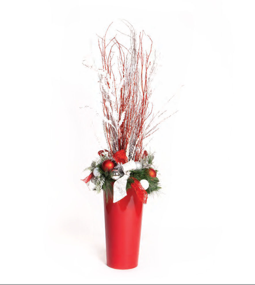 Red and white branch display in a red planter